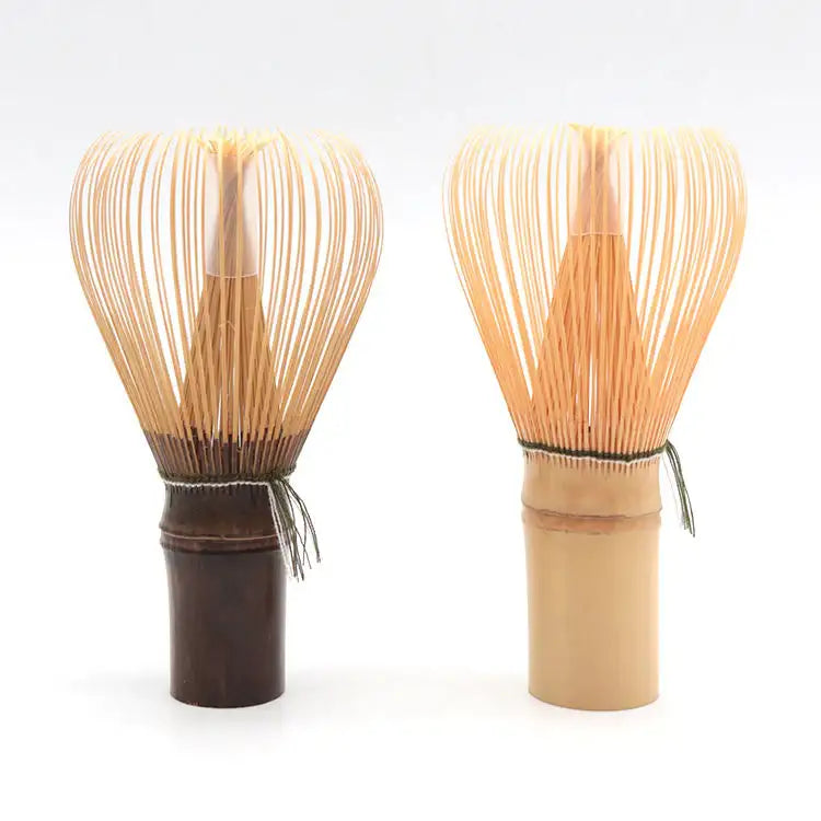 Two Japanese bamboo matcha whisks with dark and light handles, handcrafted for tea ceremony