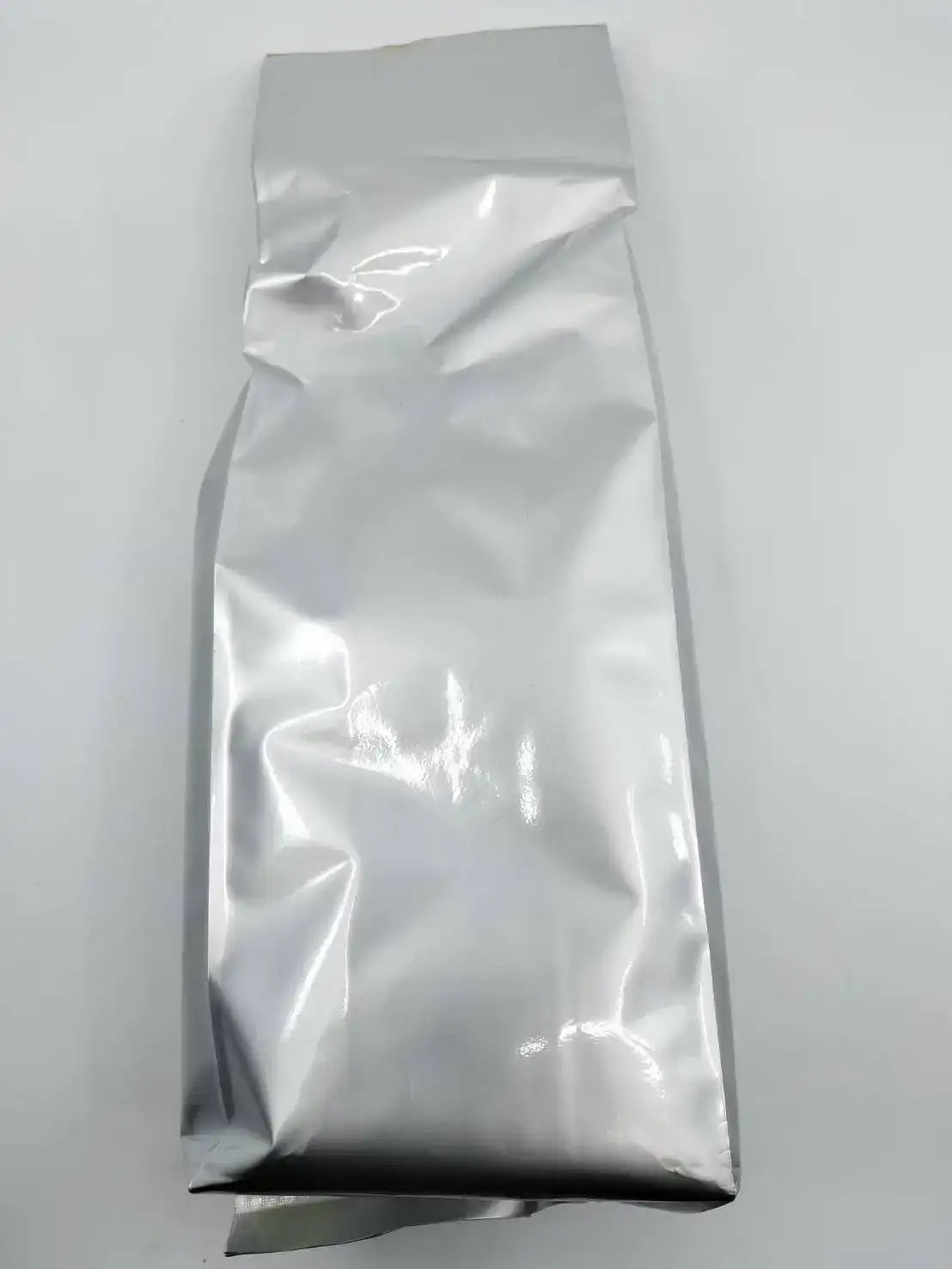 Shiny silver tea bag packaging for premium Japanese tea, sealed and ready for shipping