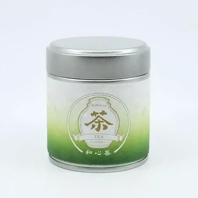 Wakokoro Tea Kyushu Matcha stored in a silver metal tin with green gradient labeling.