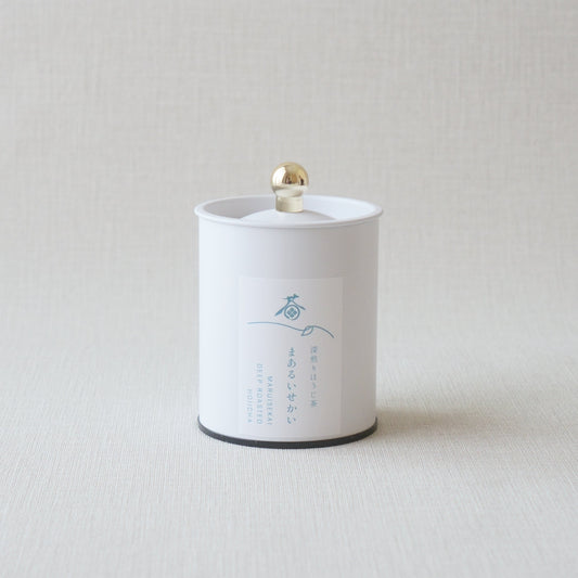 White cylindrical container with a gold cap on a light gray background