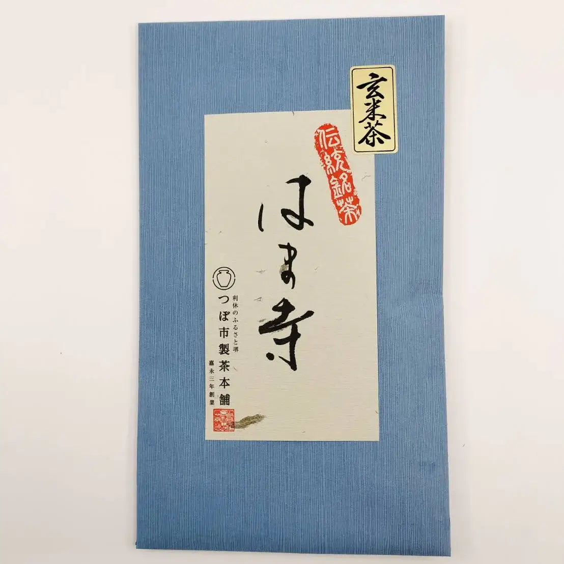 Blue packaging with a white label featuring Japanese text and a logo on a light gray background