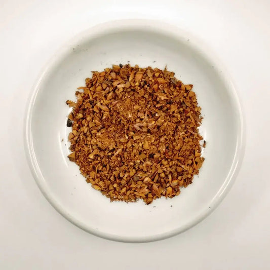 Dry spice mix on a white plate with a white background