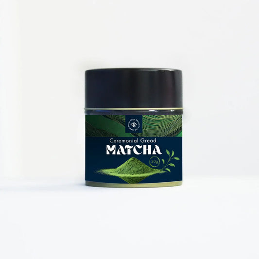 Ceremonial grade matcha tea tin with green matcha powder illustration on label