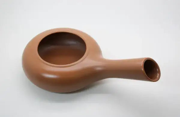 Handcrafted Japanese ceramic tea pitcher with smooth brown finish, ideal for traditional tea ceremonies.