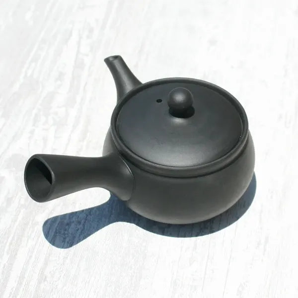 Black ceramic Japanese teapot with side spout, ideal for premium tea brewing