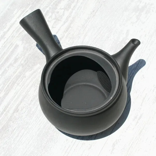 Black ceramic Japanese teapot with built-in strainer, ideal for loose leaf tea brewing