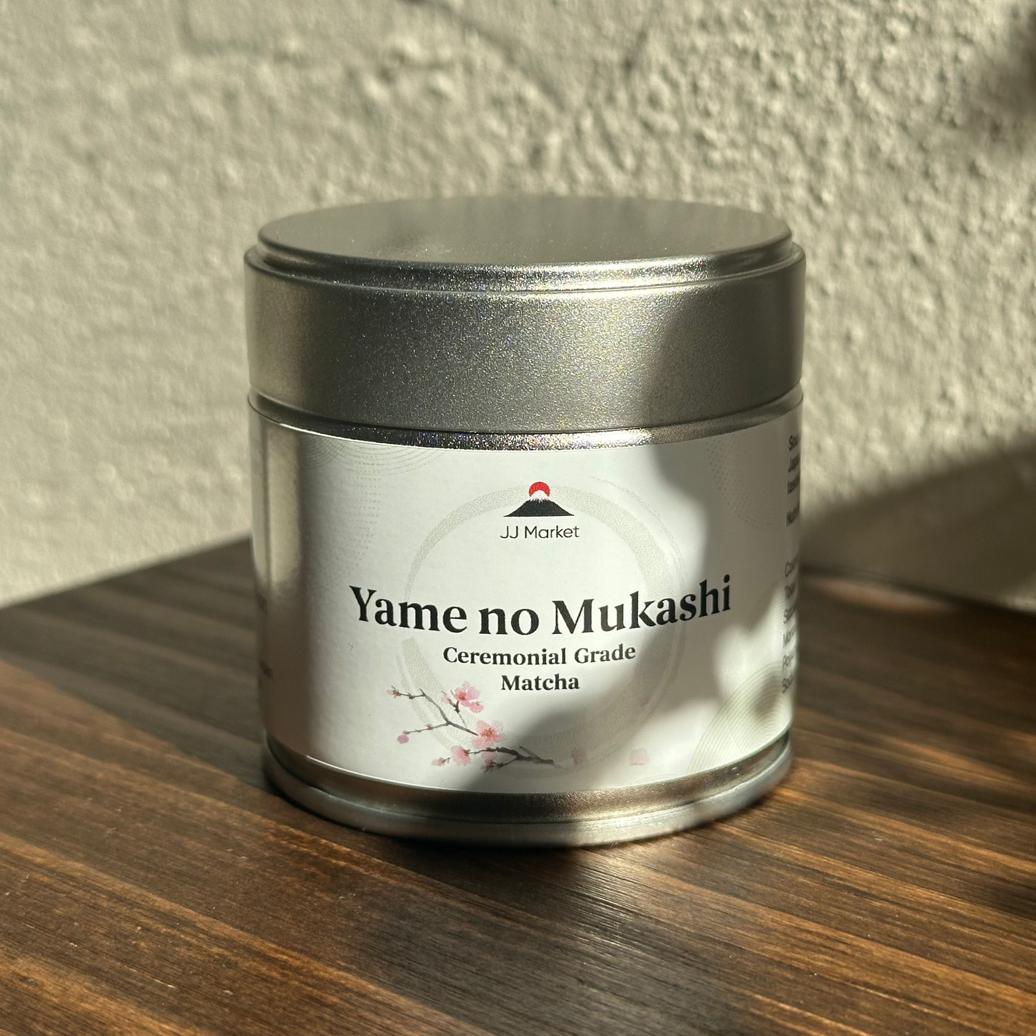 Yame no Mukashi ceremonial grade matcha tin on wooden surface in sunlight