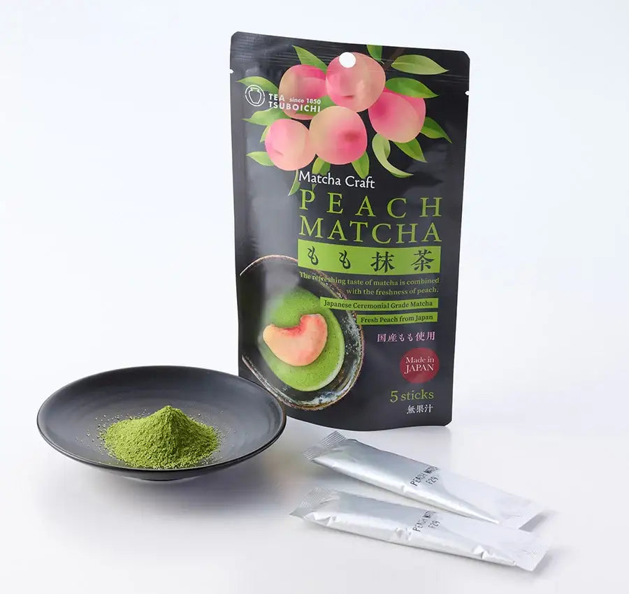 Peach Matcha powder in black bowl with Tsuboichi package, Japanese ceremonial grade green tea with fresh peach flavor