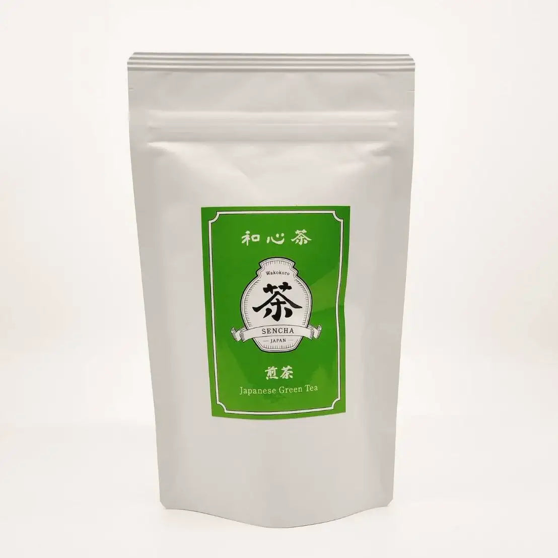 Premium Japanese Sencha green tea in white resealable pouch with green label, authentic Japanese tea