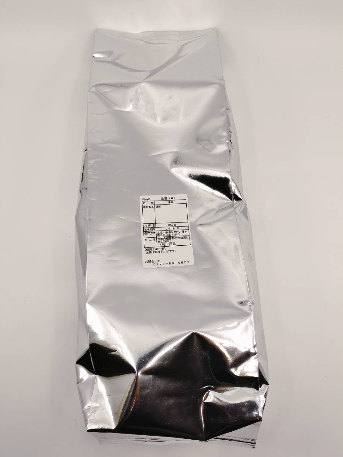 1000g silver bag of Japanese matcha powder with product label, ideal for tea enthusiasts