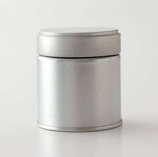 Sleek silver tea canister for storing premium Japanese tea leaves, minimalist design